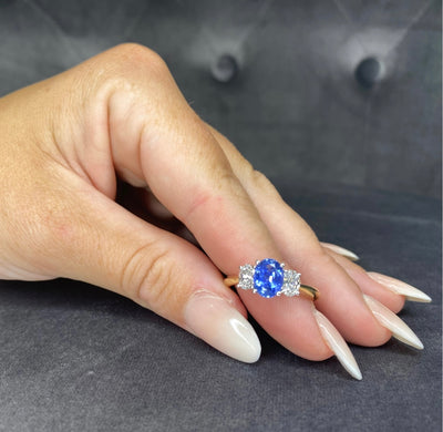 18ct ceylon sapphire and diamond trilogy ring on hand