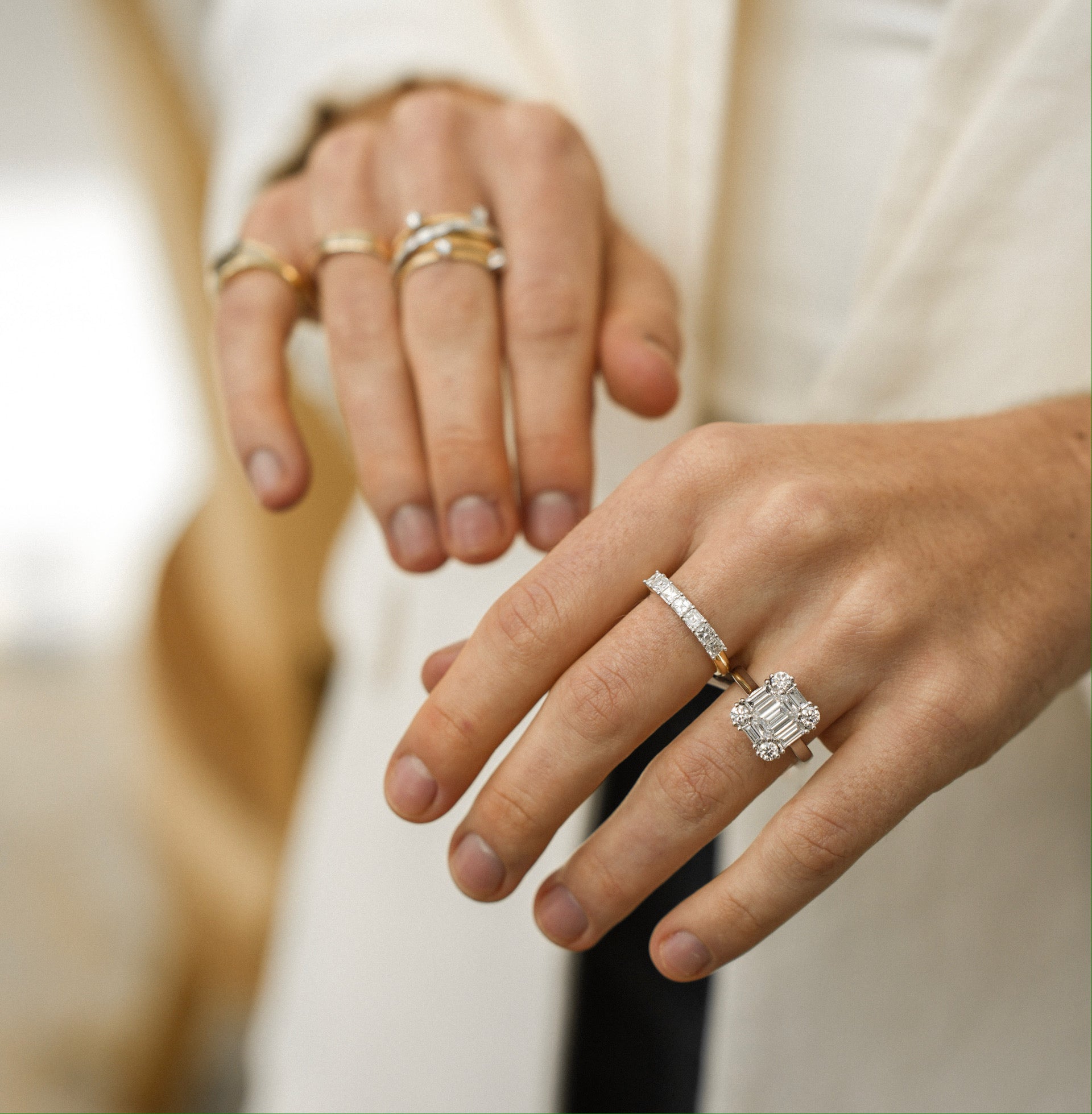 Woman's hands with diamond engagement rings on it