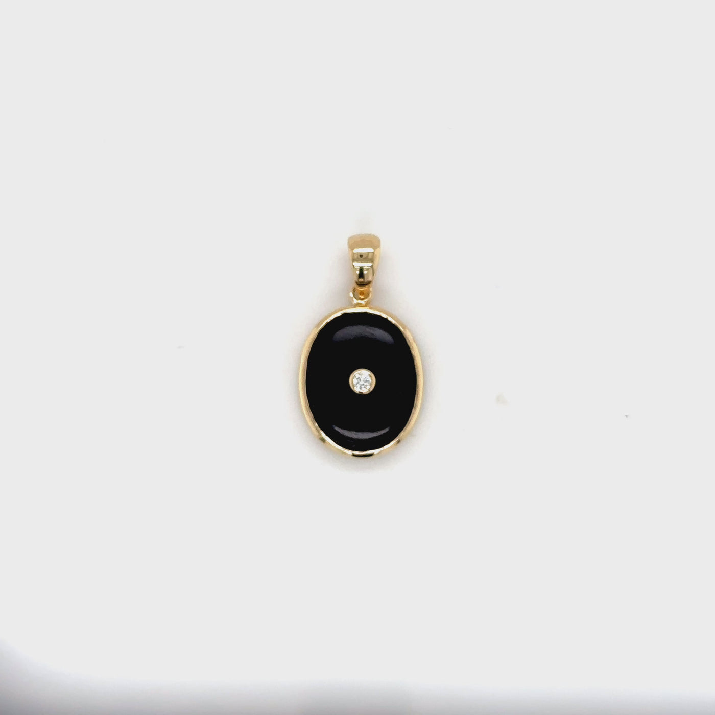 9 carat yellow gold, onyx and diamond pendant