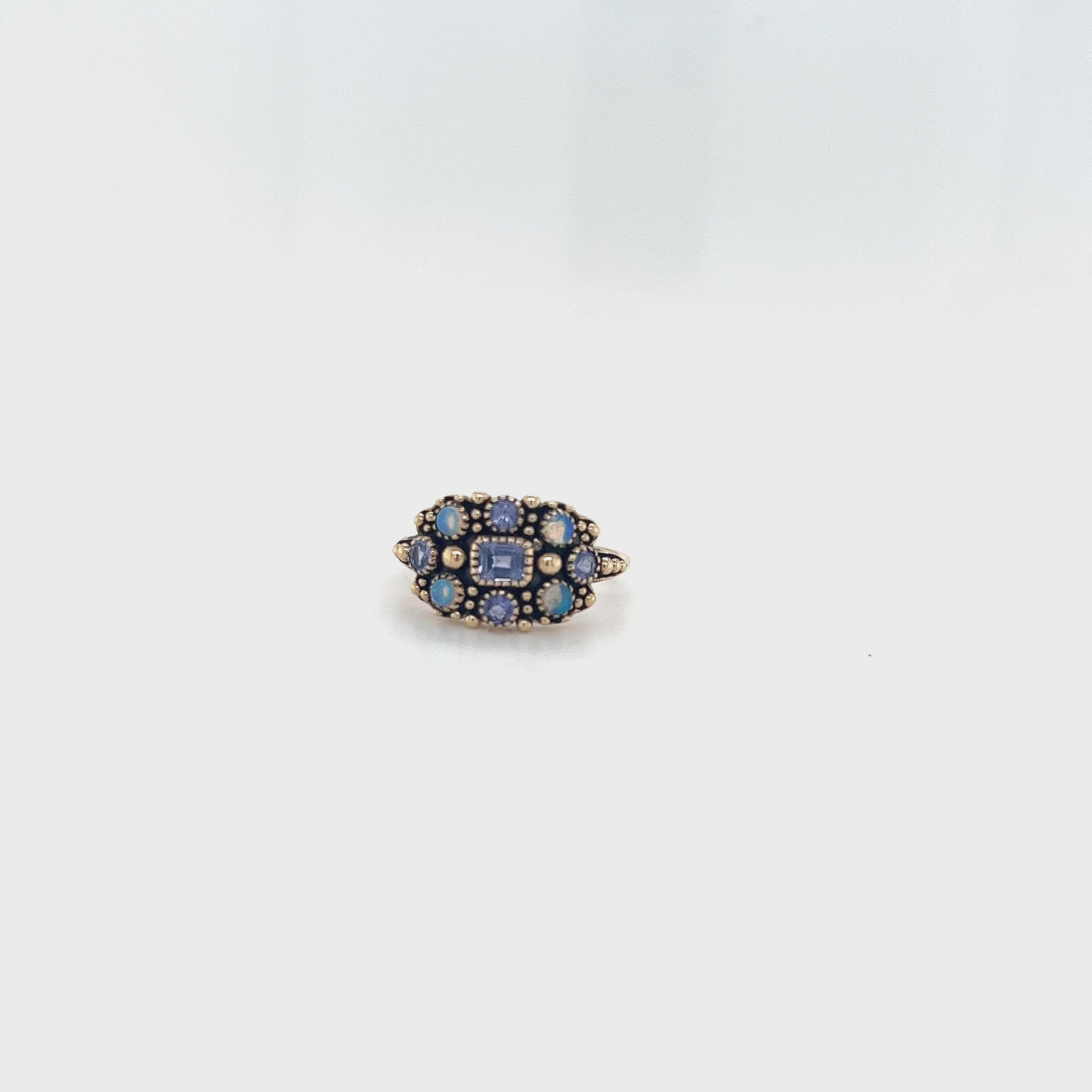 9 Carat Yellow Gold Ring with Tanzanite and Solid Opal.