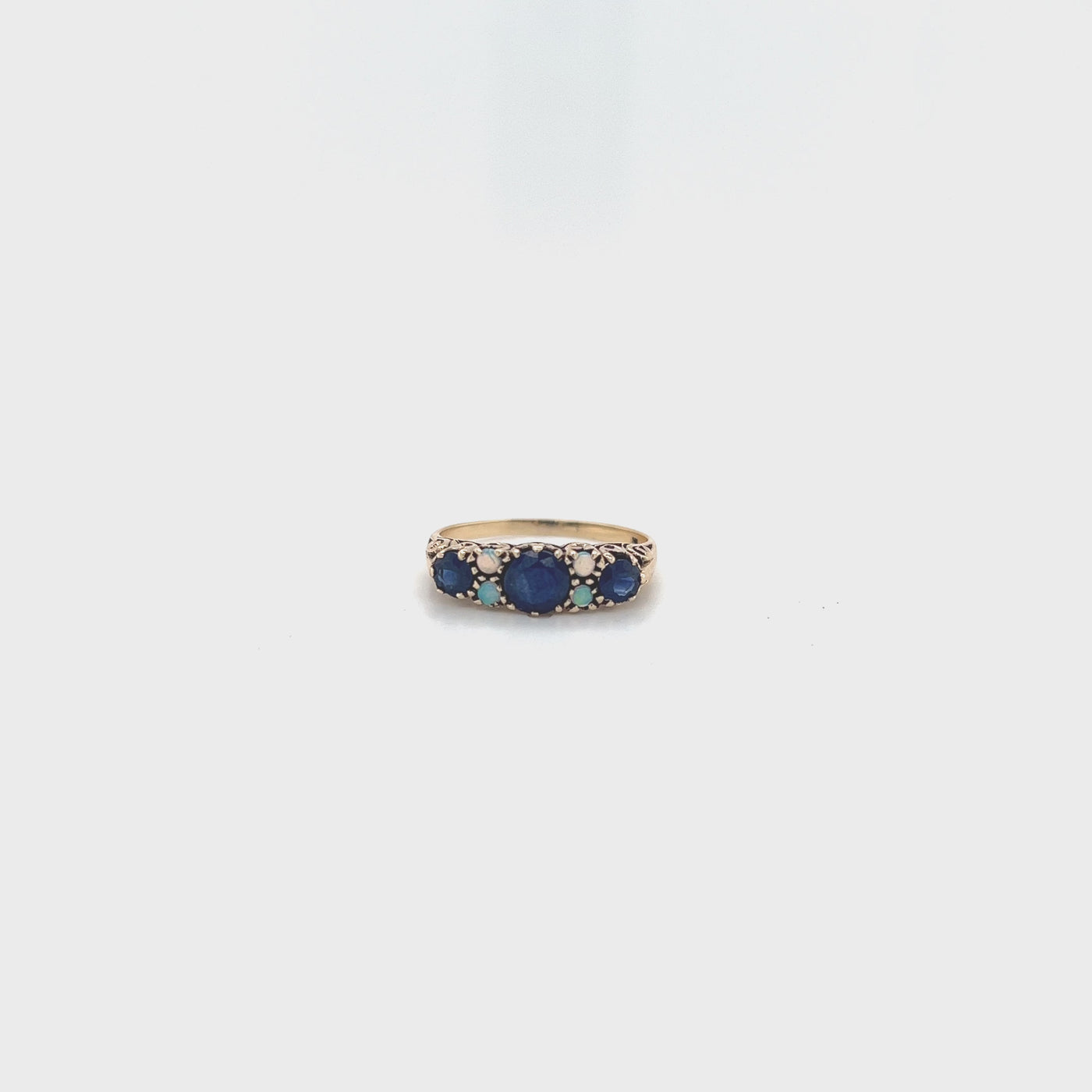 9 carat yellow gold ring with sapphires and opal