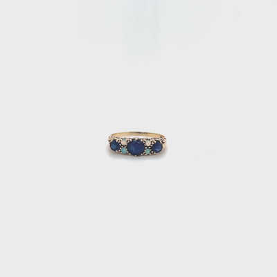 9 carat yellow gold ring with sapphires and opal