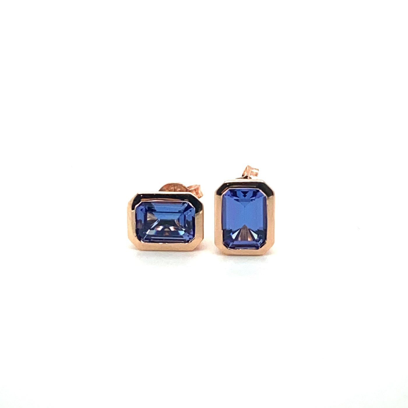 9ct rose gold emerald cut tanzanite bezel set earrings