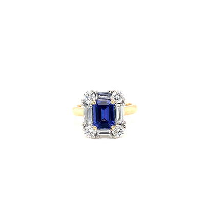 9ct yellow and white gold emerald cut tanzanite and eco-diamond ring featuring round brilliant cut and baguette diamonds.