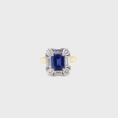 9ct yellow and white gold emerald cut tanzanite and eco-diamond ring featuring round brilliant cut and baguette diamonds.